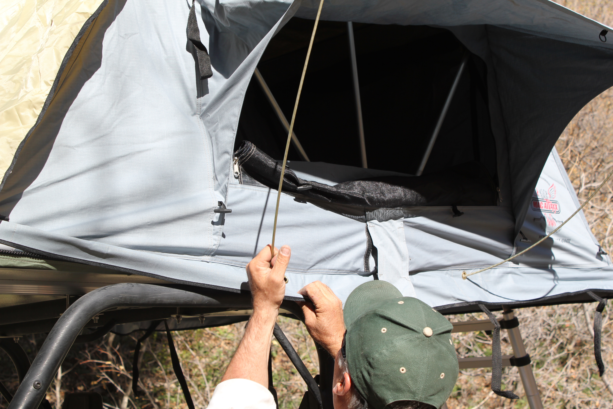 Install the supplied awning poles for your side by side roof top tent