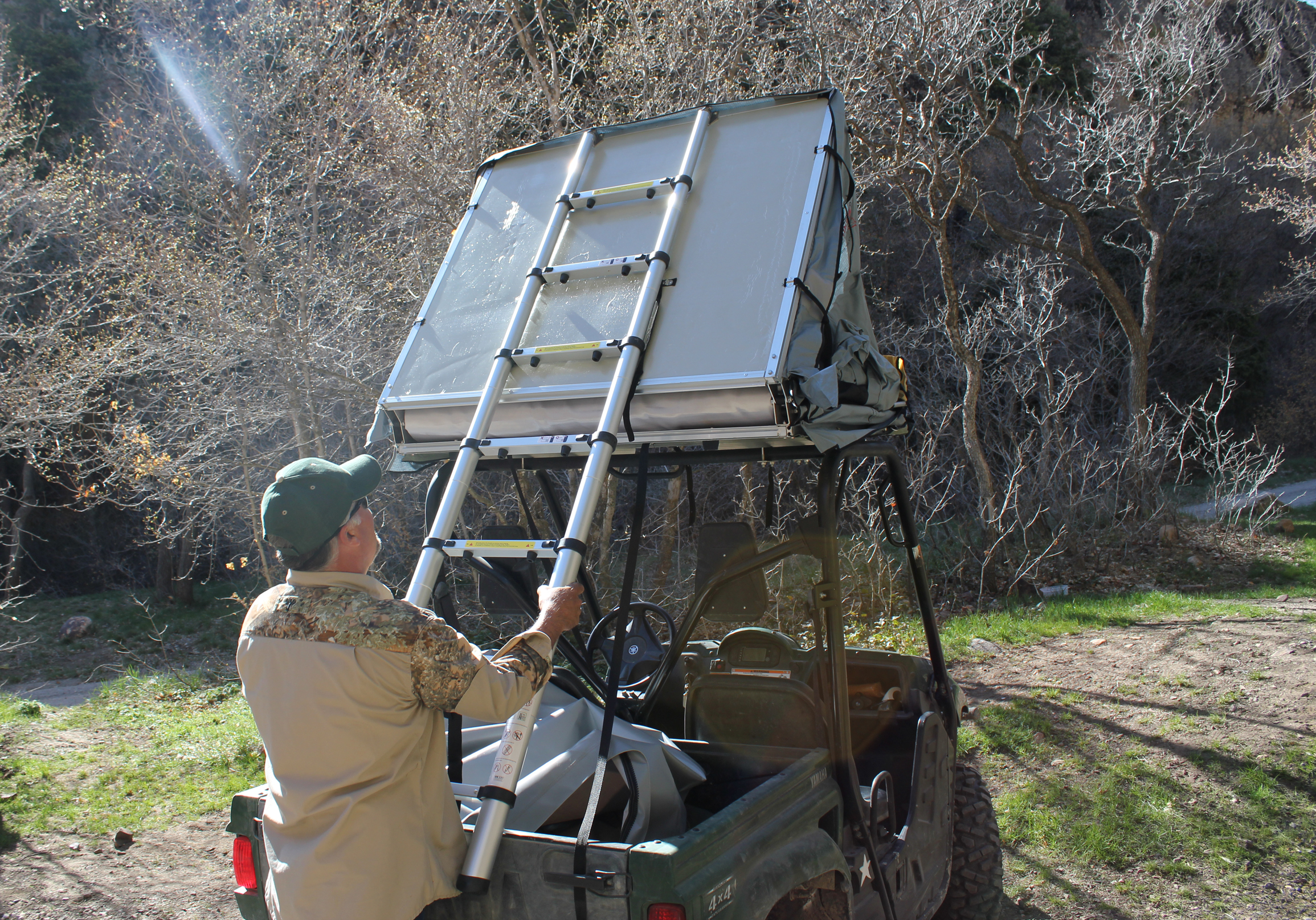 Now push down on the ladder to unhinge your camping tent