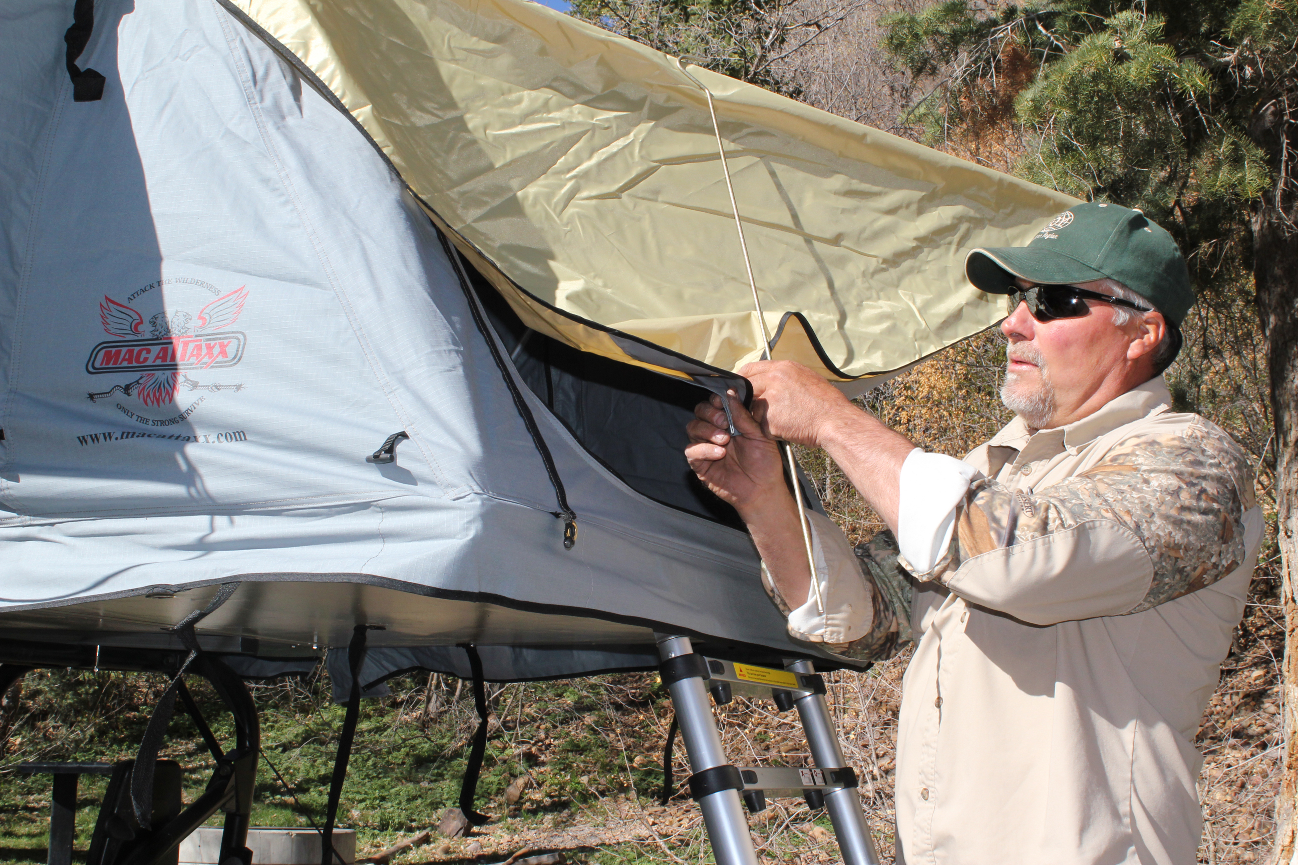 Secure the rain fly to the spring rods being installed at the door for your roof top tent