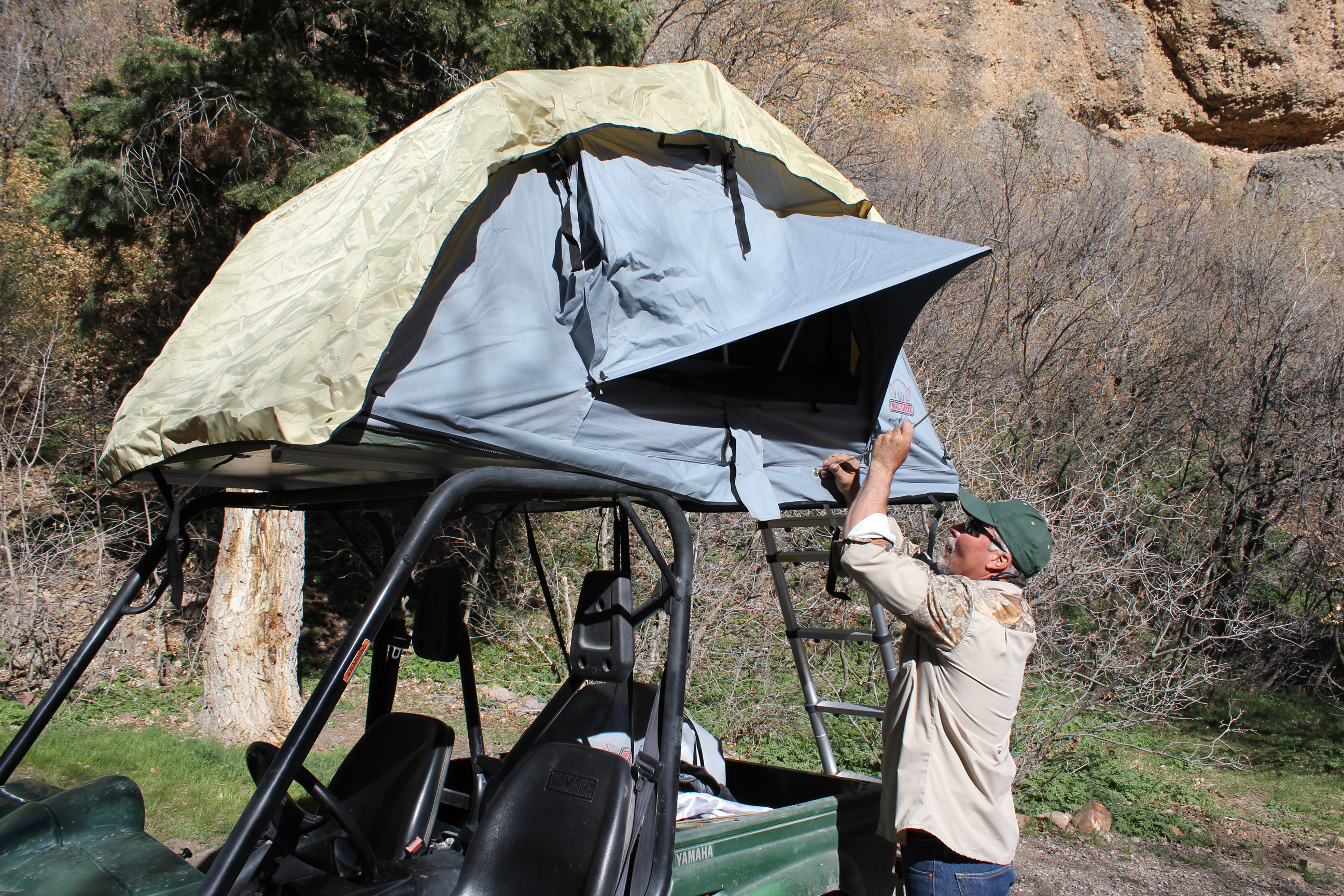 Install the supplied awning poles for your side by side roof top tent
